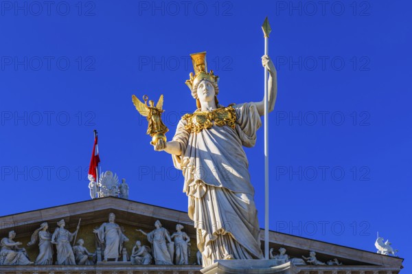 Pallas-Athena Fountain, The goddess of wisdom, holding a spear in her left hand, the goddess of victory Nike in her right hand, behind her the building of the parliament, Vienna, Austria, Europe