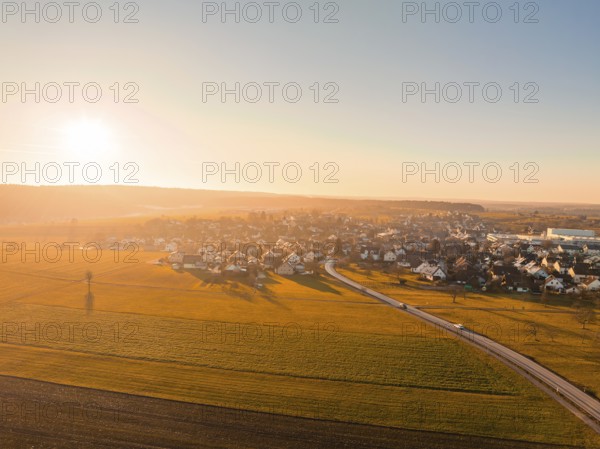 Fields and village in the warm light of sunset, aerial view, Obergaugstett, Calw district, Black Forest, Germany, Europe