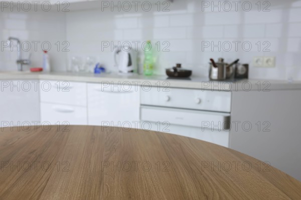 Modern kitchen space with a wooden table