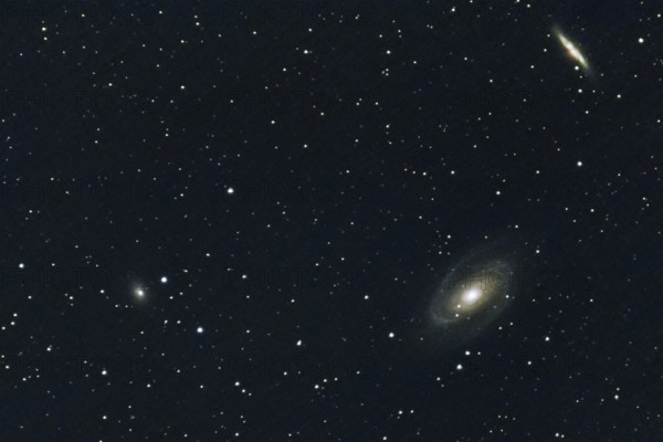Two spiral galaxies (M 81 and M 82) and other galaxies, embedded in a star-studded deep space, Haibach, Lower Bavaria