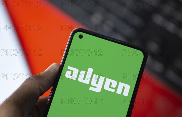 Dhaka, Bangladesh- 09 Nov 2024: Adyen logo is displayed on smartphone. Adyen is a Dutch payment company