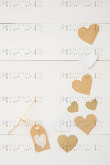 Small paper hearts scattered table