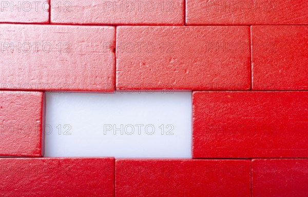Red color domino blocks placed on a white background