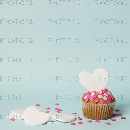 Tasty cake with decorative hearts