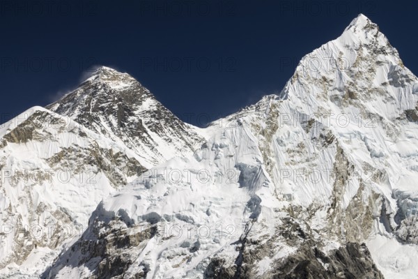 Mount Everest, known Chomolungma in Tibet and Sagarmatha in Nepal, seen from the top of Kala Patthar, 5645m, the popular trekking peak and the Everest viewpoint in the Khumbu Valley. The main peak and South Summit of Everest are well visible, South Col is right of them. The ridge rises from it towards the main summit of Lhotse. Nuptse Nup II is on the right-hand side. Autumn, post-monsoon trekking season. Khumbu, Himalayas. Sagarmatha National Park, UNESCO World Heritage Site. Solukhumbu, Nepal, Asia