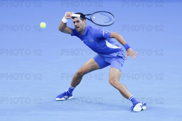 MELBOURNE, AUSTRALIA, JANUARY 11: Novak Djokovic of Serbia plays Stefanos Tsitsipas of Greece during a charity match ahead of the 2024 Australian Open at Melbourne Park on January 11, 2024 in Melbourne, Australia, Oceania
