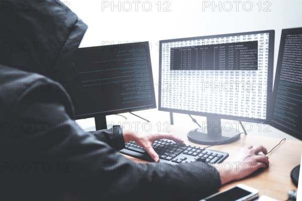 Hack concept. Picture of male hacker trying to steal information from system while looking at computer, isolated on white background