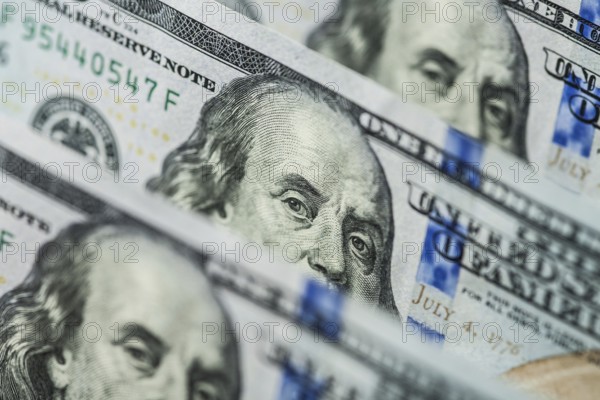 Hundred dollars bills standing in a row. Selective focus