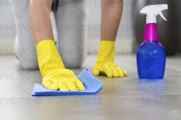 Great concept of domestic cleaning, woman cleaning the floor