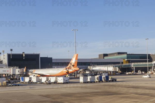 Melbourne, Australia, March 03 2023: Jetstar aircraft at boarding gates at Melbourne Tullamarine Airport in Victoria, Australia, Oceania