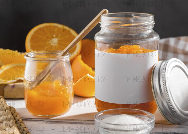 Front view transparent jar with orange jam