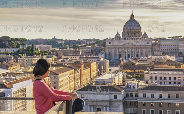 Rome Vatican Italy high angle view sunset city skyline with woman tourist