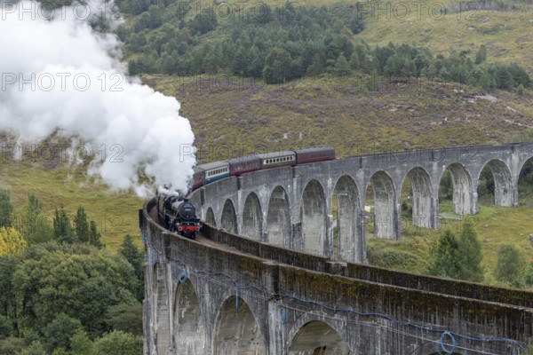 The Jacobite Steam Train, steam railway on the Glenfinnan railway viaduct, known from Harry Potter, Glenfinnan, Highlands, Scotland, Great Britain