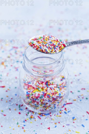 Colorful sugar sprinkles for baking in icy tone - baking concept
