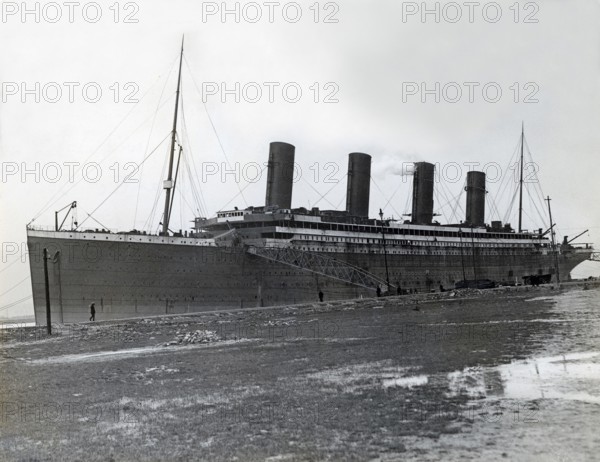 The Titanic. A British passenger liner operated by the White Star Line which sank in the North Atlantic Ocean on 15 April 1912 after striking an iceberg during her maiden voyage from Southampton to New York City. The Titanic was launched on 31 May 1911 and was towed to a fitting-out berth where over the course of the following year, engines, and interior was fitted out. The picture taken at Harland and Wolff in Belfast, Ireland in march 1912 during this time prior Titanic's sea trials and maiden voyage