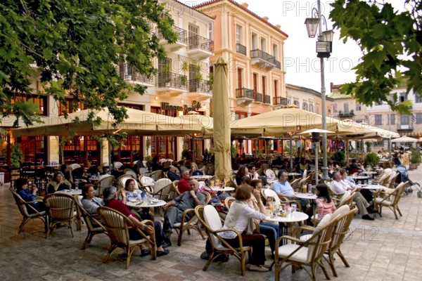 Guests in street cafe, Plateia Sindagmatos square, Nafplion, Nafplio, Peloponnese, Greece, Europe