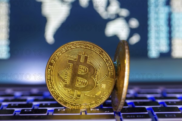 Symbolic bitcoins on a laptop