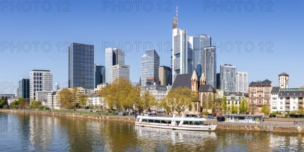 Frankfurt skyline skyscrapers with banks on the river Main with excursion boat panorama in Frankfurt, Germany, Europe