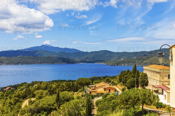 View of the Stella Gulf from Capoliveri, Monte Capanne in clouds in the background, Elba Island, Tuscan Archipelago National Park, Tuscany, Italy, Europe