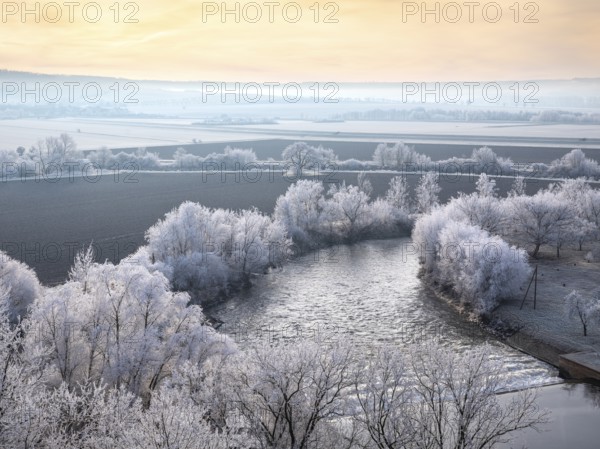 View of the river Unstrut in the Unstrut valley in winter at dawn, fields and trees covered with hoarfrost, Memleben, Saxony-Anhalt, Germany, Europe