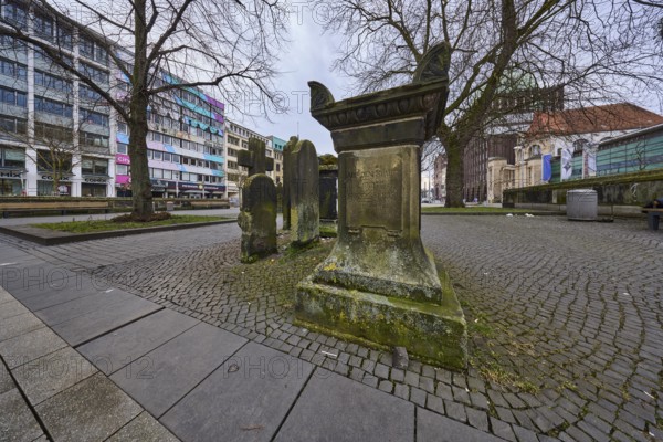 Historic gravestones, general architecture, pavement made of cobblestones and paving slabs, diffuse light, cloudy, Goseriede street, Hanover, state capital, Hanover region, Lower Saxony, Germany, Europe