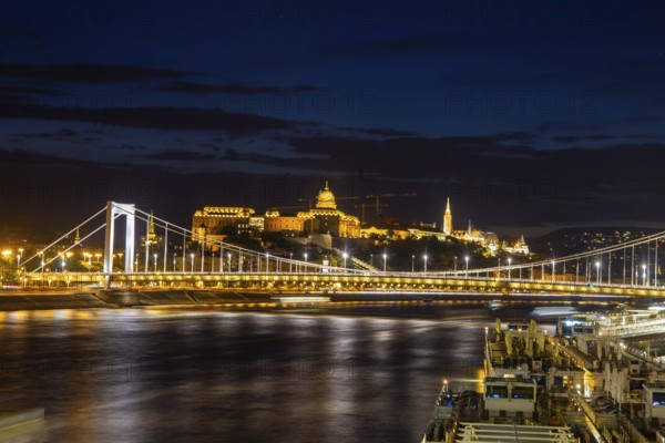 Budapest at night with the Danube, the illuminated Elisabeth Bridge and the illuminated Castle Palace