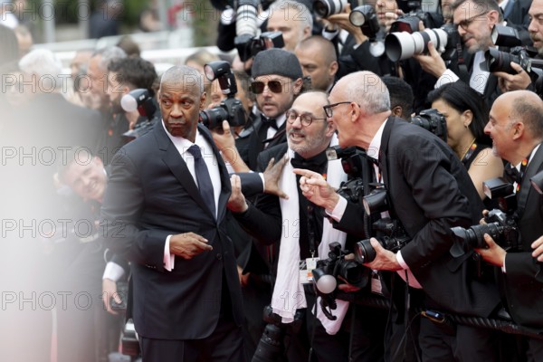 Cannes, France - 19.5.2024: Denzel Washington jokes with photographers during the - Highest 2 Lowest - Red Carpet during the 78th Cannes International Film Festival. The film festival takes place from 13 to 24 May 2025