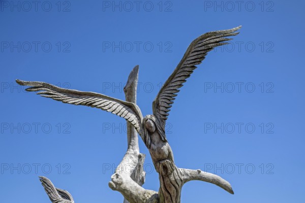 Bay St. Louis, Mississippi - An 'Angel Tree, one of several carved by chainsaw sculptor Dayle K. Lewis. Three people survived Hurricane Katrina in 2005 by clinging to this tree