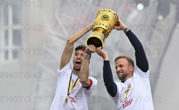 Coach Sebastian Hoeneß VfB Stuttgart captain Atakan Karazor VfB Stuttgart (16) with trophy, jubilation joy emotion VfB Stuttgart victory celebration, VfB Stuttgart team celebrates winning the DFB Cup 2025 in Stuttgart at Schlossplatz, Stuttgart, Baden-Württemberg, Germany, Europe