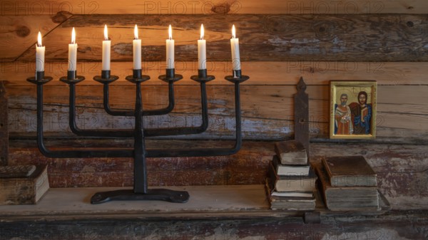 Seven-armed candlestick with burning candles, icon, chapel, Fokstugu farm, Fjellstue, pilgrims' accommodation, mountain hut, Olav's Path, Olavsleden or Pilgrims' Path, Dovrefjell-Sunndalsfjella National Park, Norway, Europe