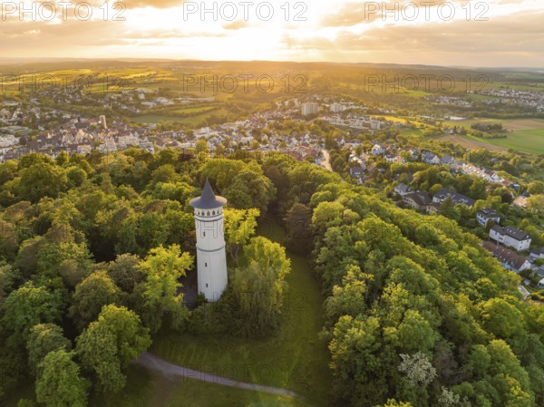 Landscape with tower in the forest at sunset and view of the village, Engelberg Tower, Leonberg, Germany, Europe