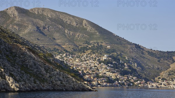 Coastal town on mountainous shores, Symi Town, Symi, Dodecanese, Greek Islands, Greece, Europe
