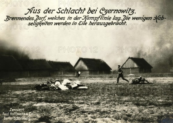 From the Battle of Czernowitz. Burning village, which lay in the battle line. The few belongings are brought out in Elie, 1914 - 1918, World War 1, reproduction of a war postcard