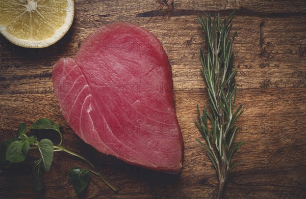 Fresh red tuna fillet, for steak, raw, top view, on a cutting board, no people