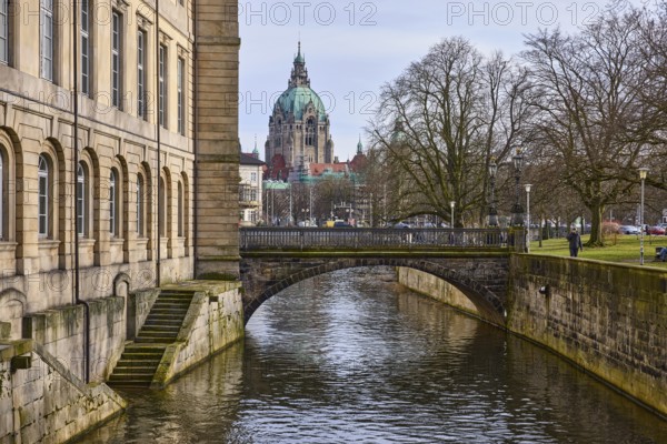 Leineschloss, Leineschlossbrücke, castle, facade, sandstone architecture, sandstone staircase, staircase, New Town Hall Hanover, bare winter trees, water surface, abstract reflections, diffuse light, milky blue cloudy sky, slightly sunny, Hanover, state capital, Hanover region, Lower Saxony, Germany, Europe