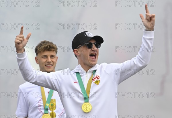 Angelo Stiller VfB Stuttgart (06) Yannik Keitel VfB Stuttgart (05) Gesture Gesture Cheering Joy Emotion Victory celebration, VfB Stuttgart team celebrates winning the DFB Cup 2025 in Stuttgart at Schlossplatz, Stuttgart, Baden-Württemberg, Germany, Europe