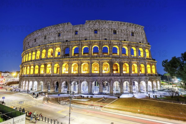 Colosseum ancient amphitheatre at night in Rome, Italy, Europe