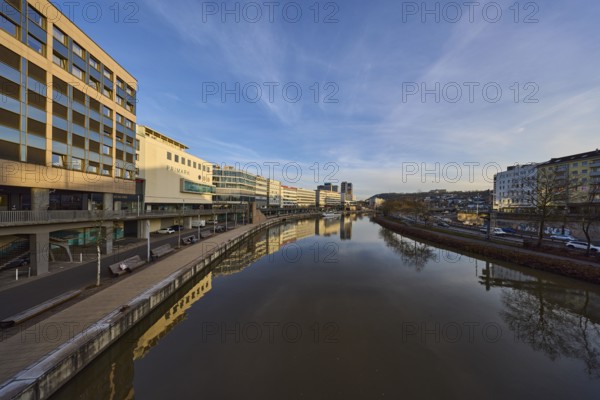 River Saar, modern architecture, trees, reflections on the water surface, fashion shop, Primark, evening light, blue sky, cirrostratus clouds, footbridge, Berlin Promenade, Willi Graf Ufer, Saarbrücken, state capital, Saarbrücken Regional Association, Saarland, Germany, Europe
