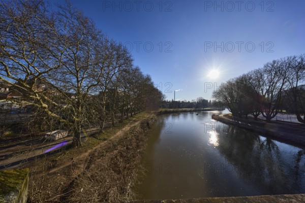 River Saar, bank, trees, meadow, abstract reflections, water surface, backlight of the sun, blue sky, cloudless, Saarbrücken, state capital, regional association Saarbrücken, Saarland, Germany, Europe