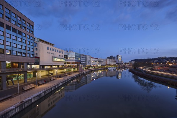 River Saar, modern architecture, trees, fashion shop, Primark, reflections on the water surface, light traces, evening blue hour, blue evening sky, cirrostratus clouds, Willi Graf Ufer, Berliner Promenade, motorway 620, Saarbrücken, state capital, regional association Saarbrücken, Saarland, Germany, Europe