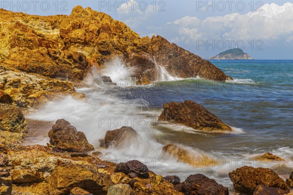 Rugged rocks and foaming spray on Topinetti beach, near Rio Marina, Elba Island, Tuscan Archipelago National Park, Tuscany, Italy, Europe