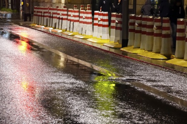 Security barrier for an event, large city at night, Germany, Europe