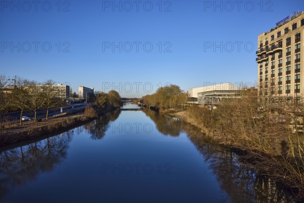 River Saar, trees, modern architecture, concrete architecture, Mercure Hotel, reflections on the water surface, blue cloudless sky, Saarbrücken, state capital, regional association Saarbrücken, Saarland, Germany, Europe
