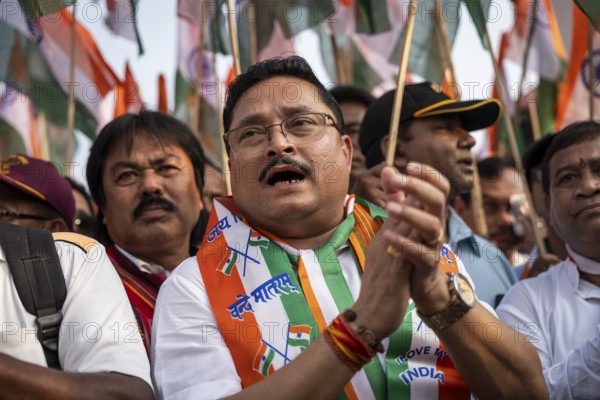 People holding Indian national flags as they take part in a rally, in soliderity with the Indian armed forces in Guwahati, India on 14 May 2025. A nationwide campaign Tiranga Yatra organized by the Bharatiya Janata Party (BJP) to honor the Indian armed forces' success in Operation Sindoor
