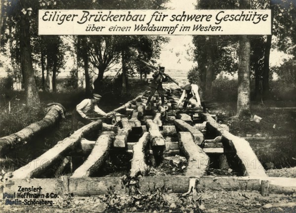 Hasty bridge construction for heavy guns over a forest swamp in the west, 1914 - 1918, World War I, reproduction of a war postcard