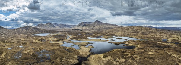 Panorama of Rannoch Moor from a drone over Loch Ba and Loch of the Armpit, A82 Highland Way, Argyll and Bute, West Highlands, Scotland, United Kingdom, Europe