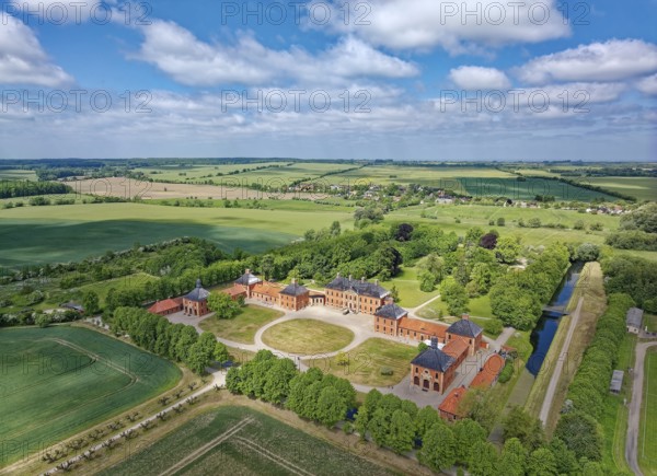 Aerial view of Bothmer Castle, a baroque three-winged complex. The castle stands on a rectangular island, surrounded by a ravine that was used for drainage. Klütz, Mecklenburg-Western Pomerania, Germany, Europe