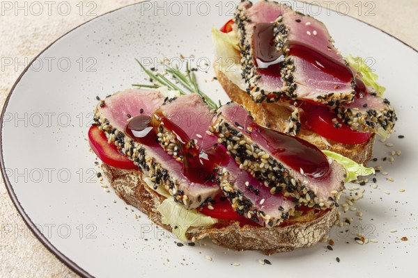 Sandwiches with fried tuna fillet, sesame, breakfast, top view, homemade