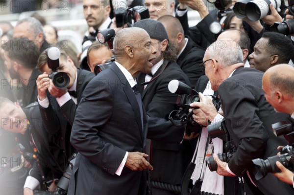 Cannes, France - 19.5.2024: Denzel Washington talks to photographers during the - Highest 2 Lowest - Red Carpet during the 78th Cannes International Film Festival. The film festival takes place from 13 to 24 May 2025