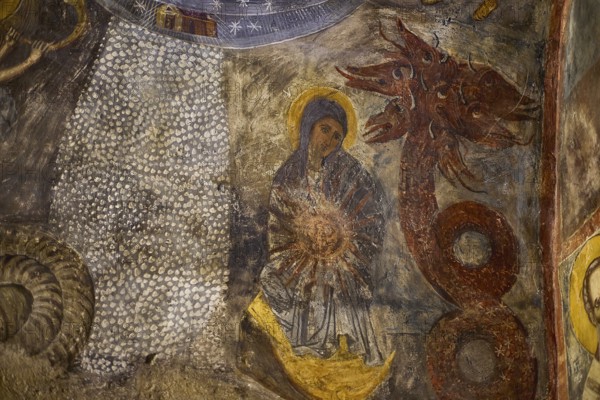 The fresco shows Mary next to a dragon-like creature with intense symbolism in a medieval context, Easter 2025, Church of the Dormition of the All-Holy God Bear, Kimisis tis Theotokou, Asklipio, Rhodes, Dodecanese, Greek Islands, Greece, Europe